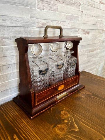 Edwardian Wooden Tantalus Set with 3 Cut Crystal Decanters &